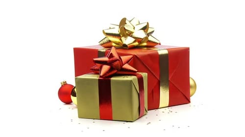 Gifts and Ornaments Rotating on White Surface