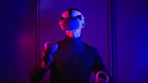 Person Wearing VR Headset with Controllers