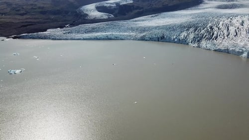 Iceland. Icebergs in a glacial lake. Aerial drone flight over Glacier Lagoon.