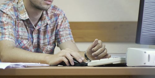 Man Works On Office Computer