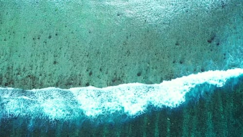 Aerial top down landscape of marine seashore beach voyage by turquoise water with white sandy backgr