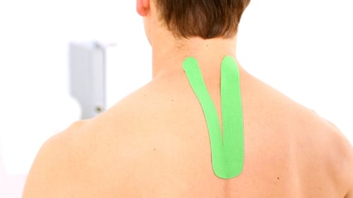 Physiotherapist Applying Green Tape 2