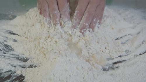 Add water in the flour.