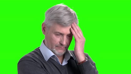 Pensive Man Thinking Against Green Screen Backdrop