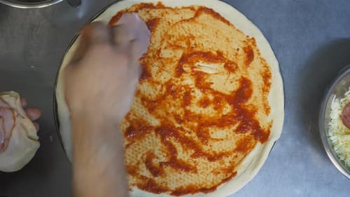 Pizza Preparation: Ham Being Added to Pizza