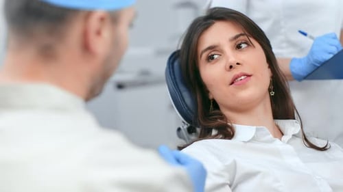 Smiling Woman Patient Visit Dentist Consulting Teeth Care Treatment at Clinic Operating Closeup