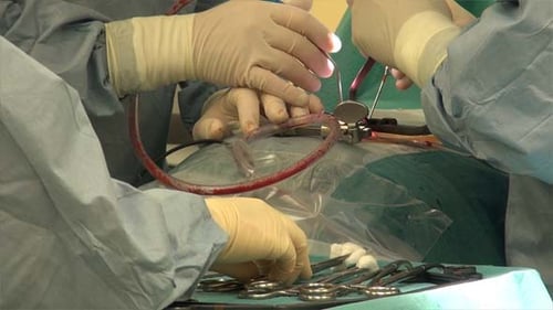 Doctors Perform Operation in Hospital Operating Room