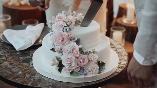 Cutting the Wedding Cake with Flowers