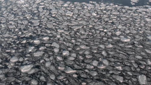 Aerial Fly Over View of Cracked Ice in the Sea