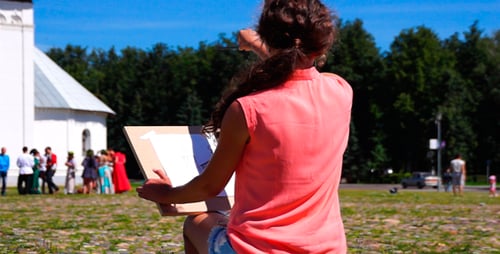 Woman Drawing in a Park on Sunny Day