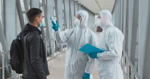 Temperature Check in Modern Corridor during Pandemic