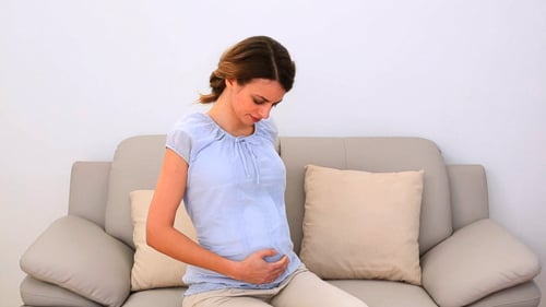 Woman Experiencing Back and Shoulder Pain