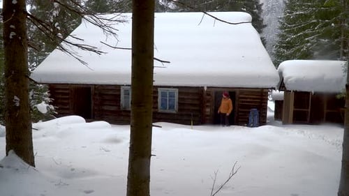 Backpacker Hiking in Winter Forest