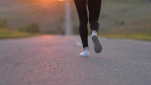 Young Fitness Woman Runner Athlete Running at Road