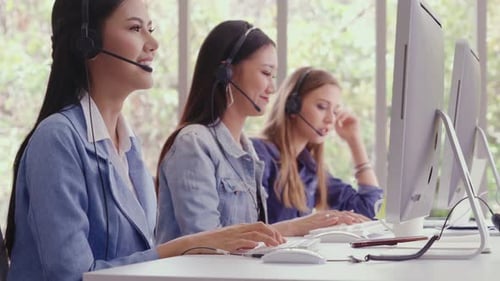 Customer Support Agent or Call Center with Headset Talking to Customer on Phone