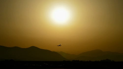 Plane Landing at Sunset