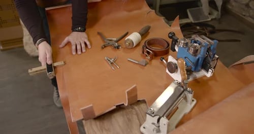 Craftsman Working with Leather in a Workshop