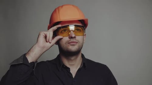 Portrait of Young Engineer with Helmet