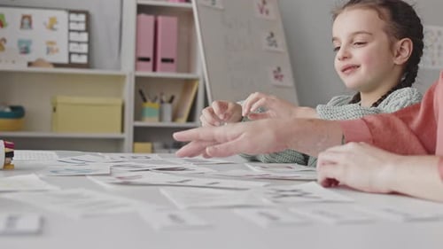 Girl Learning Alphabet with Speech Therapist
