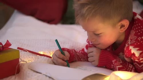 Child Writes Letter to Santa for Christmas