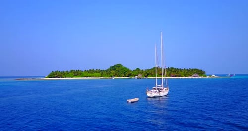 Tropical fly over abstract shot of a paradise sunny white sand beach and aqua blue ocean background