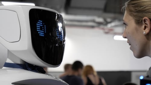 Girl is interacting with the humanoid robot