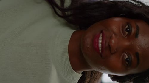 Woman Smiling in a Close-up Portrait Indoors