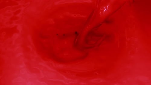 Pouring Red Color Into Red Color Swirl