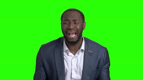 Desperate Businessman Crying on Green Screen.