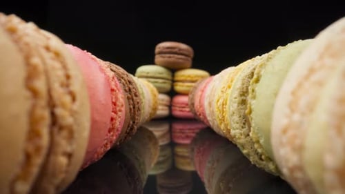 Colorful Macarons Close Up on Reflective Surface