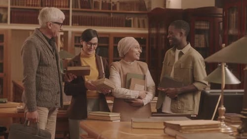 Portrait of Diverse Group of People with Books at Library