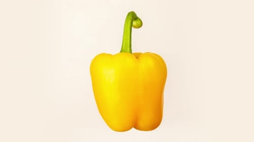 Rotating Yellow Bell Pepper on White Background
