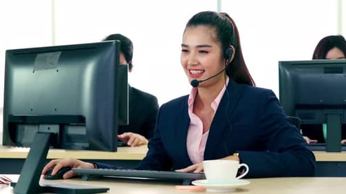 Business People Wearing Headset Working in Office