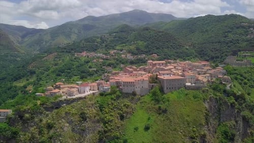 Aerial Medieval Village on Cliff Overlooking Mountain Gorge, Old Town Buildings with Red Tile Roofs