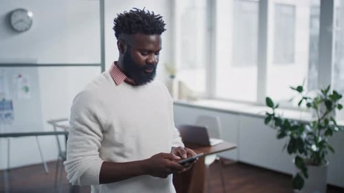 Young Black Man Texting Message