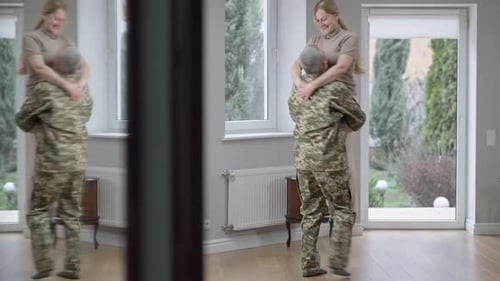 Man in Military Uniform Embraces Woman