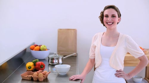 Woman Prepares Food in a Kitchen