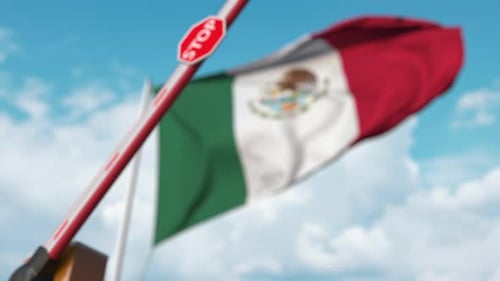 Mexican Flag Barrier Gate Closes with Stop Sign