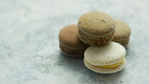 Delicious Colorful Macarons Stacked on Gray Surface