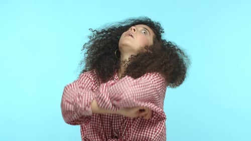 Woman with Curly Hair Thinking and Pondering
