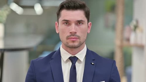 Man in Suit Stares Directly at Camera