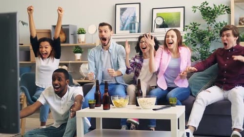 Enthusiastic Friends Watching Sports at Home