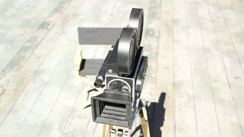 Vintage Film Camera on Tripod Rotating in Studio Environment