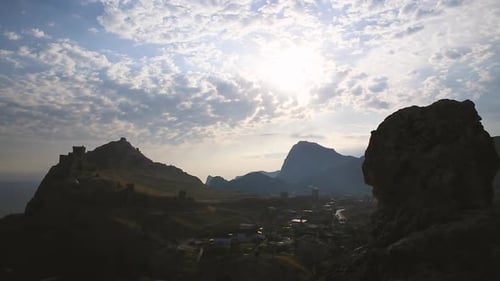 Ancient Genoese Fortress in Sudak Town. Panorama View at Sunset. Crimea.