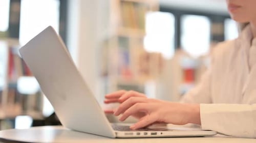 Female Hands Typing on Laptop Keyboard Close Up