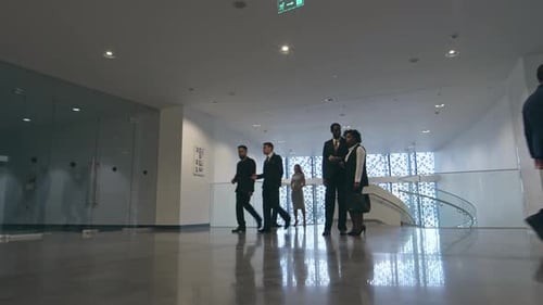 Businesspeople in Lobby of Modern Business center