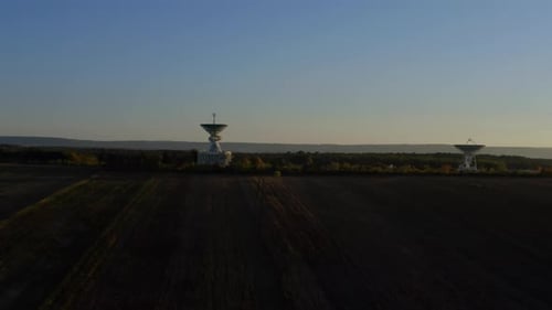 Wide View Footage of Aerial Drone Shot of Two Telecommunications Antenna or Radio Telescope
