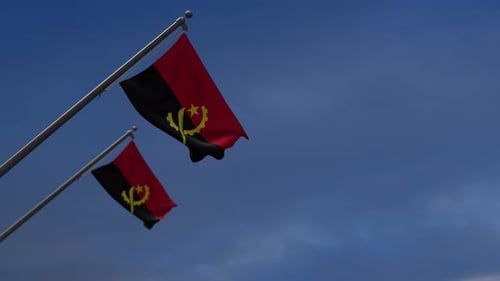 Realistic Angola Flag Waving Animation Against a Blue Sky