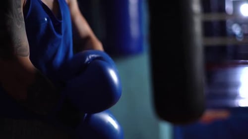 Athletic Person Prepares For Boxing Training in Gym