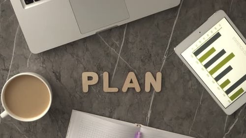 Hand Spells Plan on Desktop Workplace